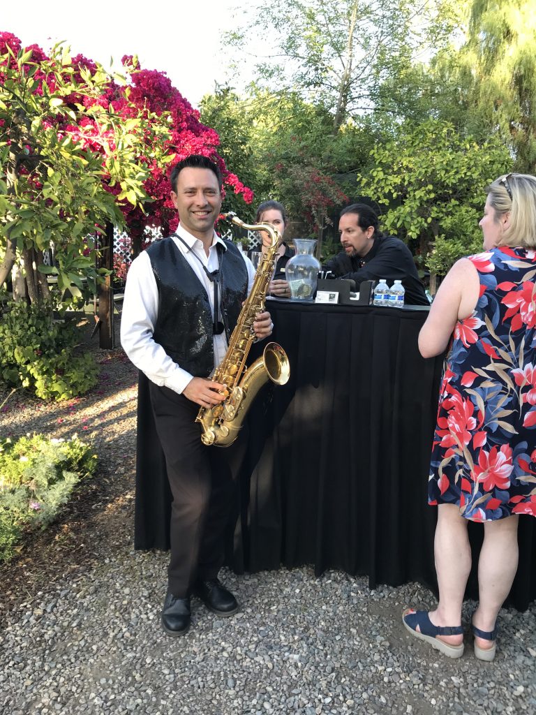 Man with saxophone at hosted bar