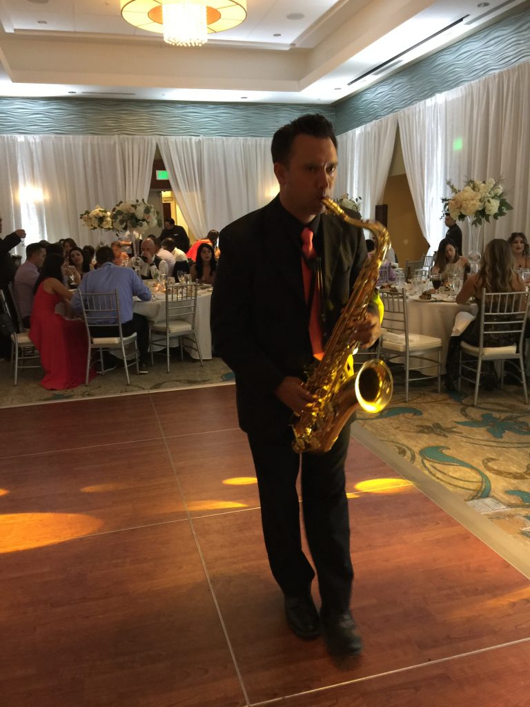 Saxophone player in a banquet dinner hall